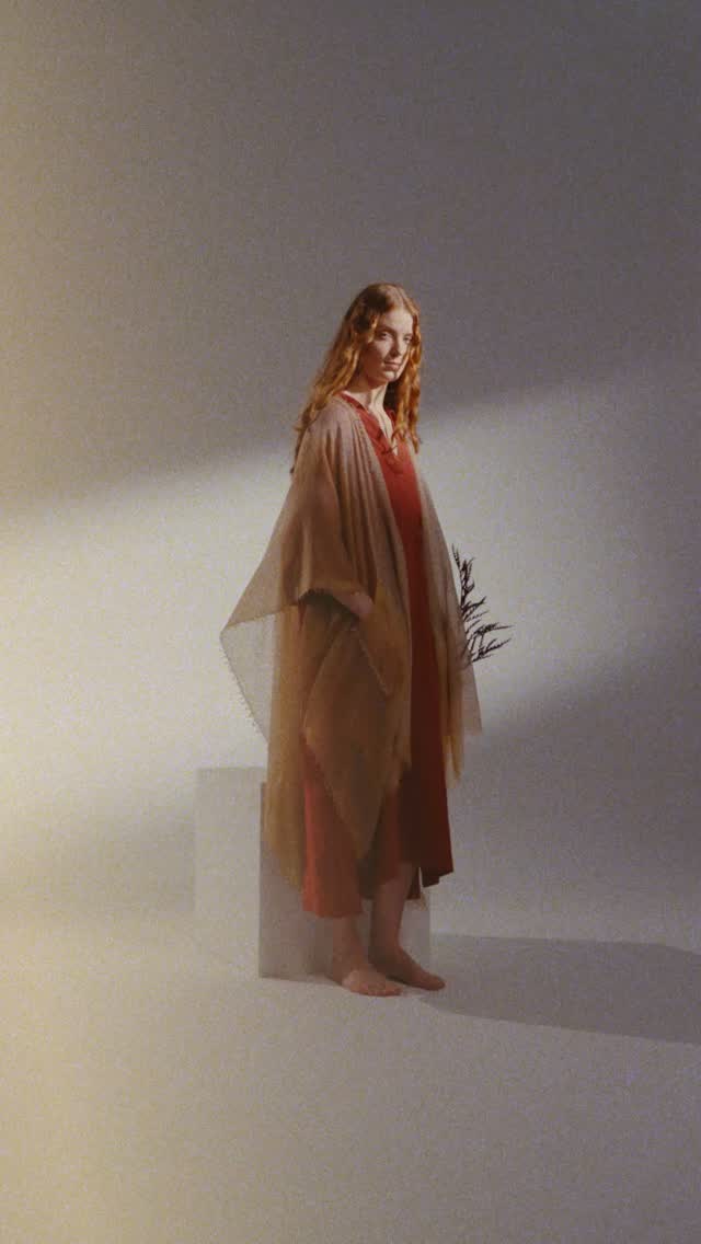 A cashmere cape in the height of August — that's the kind of contradiction only 