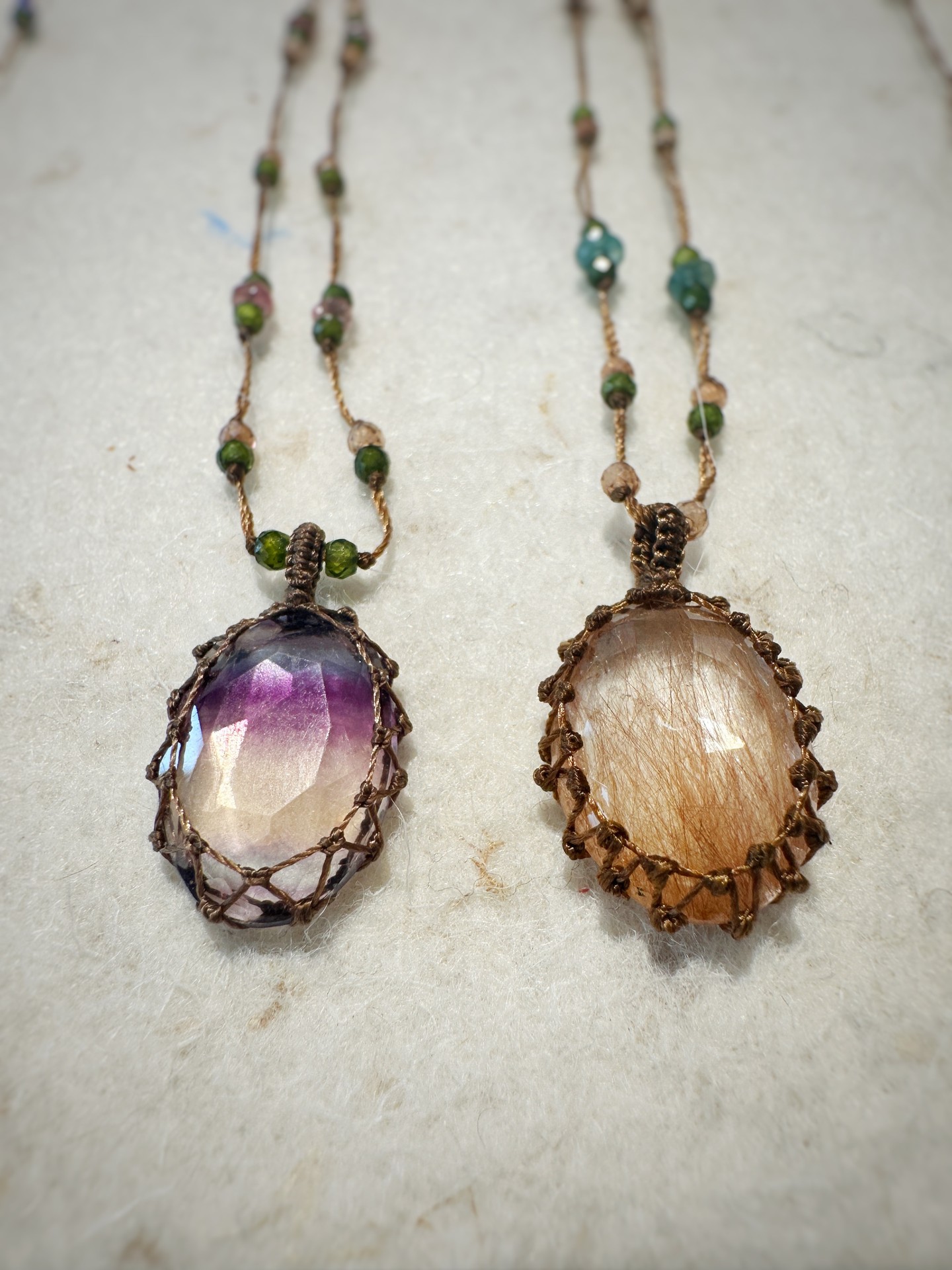 Electric blue tanzanite, caught in hand-knotted macramé thread with tourmaline b